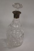 A cut glass silver mounted decanter, Birmingham 1914. CONDITION REPORT: Good condition, time aged