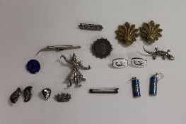 Seventeen sterling silver and continental white metal earrings and brooches. (17) CONDITION