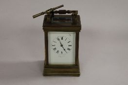 An early twentieth century chiming brass carriage clock, with key, height 15 cm. CONDITION REPORT:
