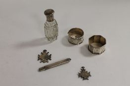 Two silver presentation fobs, together with two silver napkin rings, a silver pencil and a