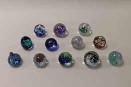 Twelve small Caithness Glass paperweights - Reflections 94, Weaver, Lace Tapestry, Fortune, Summer