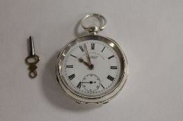 A silver pocket watch, Chester 1900, J.G.Graves Sheffield, with key. CONDITION REPORT: Excellent