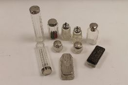 Ten silver topped glass dressing table bottles. (10) CONDITION REPORT: Good condition, some time