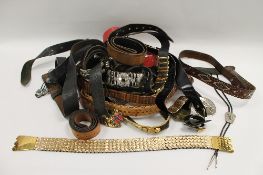 A large quantity of leather and other vintage belts. (Q) CONDITION REPORT: Good condition dating