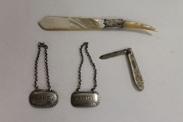Two silver decanter labels, London 1802/16, together with a Mother of Pearl silver mounted letter