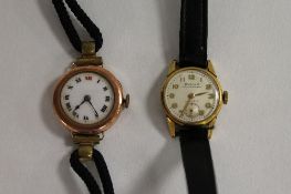 A 9ct gold Lady's wrist watch, together with a Dulux Lady's watch. (2) CONDITION REPORT: Good