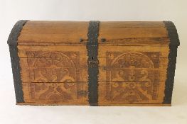 An early twentieth century continental oak domed topped trunk, width 143 cm. CONDITION REPORT: