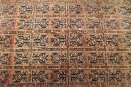 An early twentieth century fringed Eastern rug, with geometric design,178 cm x 116 cm. CONDITION
