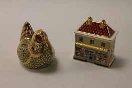 Two Royal Crown Derby English bone china paperweights : Farmyard Hen, height 8 cm, and The China