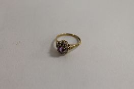 A 9ct gold amethyst and diamond ring. CONDITION REPORT: Good condition.