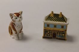 Two Royal Crown Derby English bone china paperweights : The Christmas Box, height 8 cm, and