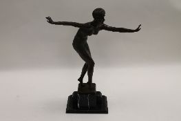 After Demetre Chiparus - An Art Deco style dancer, bronze study on black marble base, height 48