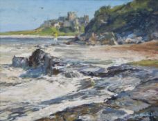 Thomas Manson : A lady on rocks with Bamburgh castle beyond, oil on board, signed, dated '78, 35