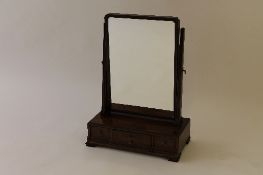 A nineteenth century mahogany dressing table mirror, fitted with three drawers, width 43 cm.