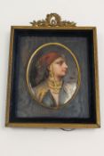 Early twentieth century school : A portrait of a lady wearing a red head scarf, oil on oval