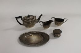 A three piece silver bachelor's tea service, Birmingham 1897, together with a small silver pot and a
