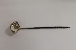 A Georgian silver toddy ladle. CONDITION REPORT: Turned horn stem, twin lip bowl, marks are rubbed