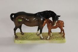 A Beswick figure - Mare and Foal, model 1811, height 16 cm. CONDITION REPORT: Excellent condition.