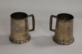 A pair of white metal tankards, presented to Major and Mrs N.E.Forth by the Officers of 41 B.G.H.