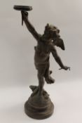 An early nineteenth century patinated spelter cherub gas lamp, on rouge marble base, signed L.
