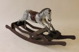 An early twentieth century wooden rocking horse, length 152 cm. CONDITION REPORT: The horse
