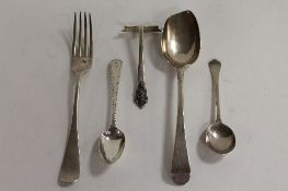 A silver table spoon, London 1772, together with four other items of silver cutlery. (5) CONDITION