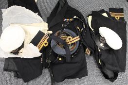 A large group of late nineteenth / early twentieth century Royal Navy uniforms and dress jackets,