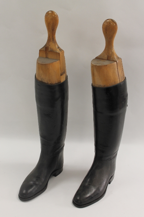 An early twentieth century pair of Lady's black leather riding boots with wooden trees, size 5.5. (