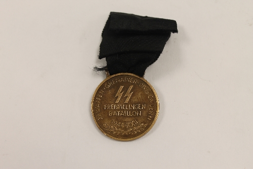 A 1944 Italian medal for the 1st Battalion Benito Mussolini, in the Waffen SS, with silk black