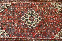 A small early twentieth century fringed Eastern rug, 126 cm x 82 cm. CONDITION REPORT: Good