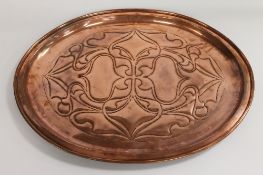 An Arts and Crafts copper charger, indistinctly stamped, width 59.5 cm. CONDITION REPORT: Good