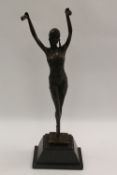 After Demetre Chiparus - An Art Deco style dancer on tip toes, bronze study on black marble base,