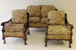 An Edwardian carved three piece begere suite. (3) CONDITION REPORT: Good condition.