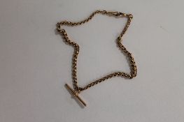 A 9ct gold Albert chain, 32.9g. CONDITION REPORT: Good condition.