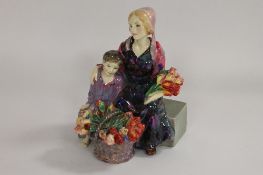 A Royal Doulton figure - The Little Mother, height 20 cm. CONDITION REPORT: A rare figurine, however