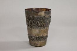 An Indian silver beaker, height 11.5cm. CONDITION REPORT: Good condition, unmarked, embossed
