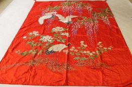 A late nineteenth / early twentieth century Oriental embroidered silk cloth, together with a pair of