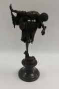 After Demetre Chiparus - An Art Deco style dancer with head down, bronze study on black marble base,