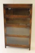 An Edwardian oak four tier stacking bookcase, width 87 cm. CONDITION REPORT: Good condition.
