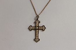 A Victorian enamel and seed pearl mourning crucifix pendant on chain. CONDITION REPORT: Good