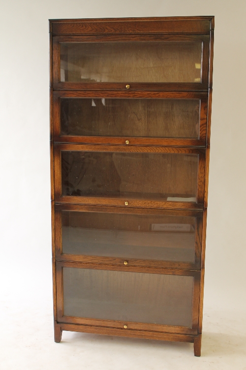 A twentieth century oak five tier stacking bookcase, width 86 cm. CONDITION REPORT: Good condition.