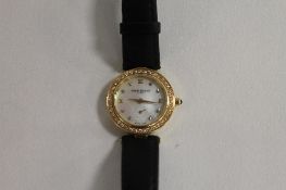 An 18ct gold Lady's watch by Pierre Balmain, encrusted with diamonds. CONDITION REPORT: Good