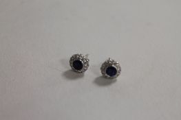 A pair of 18ct white gold diamond and sapphire earrings. (2) CONDITION REPORT: Good condition.