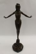 After Jules Juan - A slender lady standing on rocks, bronze study on black marble base, height 72