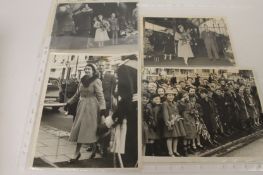 A rare collection of monochrome photographs showing Her Majesty Queen Elizabeth II on her visit to