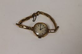A 9ct gold Lady`s wrist watch by Northern Goldsmiths. On gilt metal expansion strap.