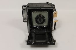 A Graflex Speed Graphic, with Compur 13.5cm lens, No. 351400, cased. DRP 258646 DRGM, Kalkart
