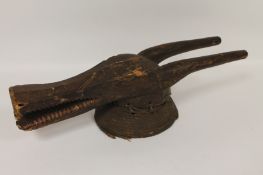 A late nineteenth / early twentieth century Bamana Komo helmet antelope mask. Time-aged and with