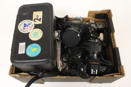 A Canon T70, together with four other cameras. (5) Lot comprises-Two Canon T70, Nikon, Petri FT