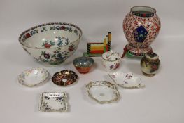 An Oriental vase, decorated with red flowers, together with a nineteenth century bowl and nine small